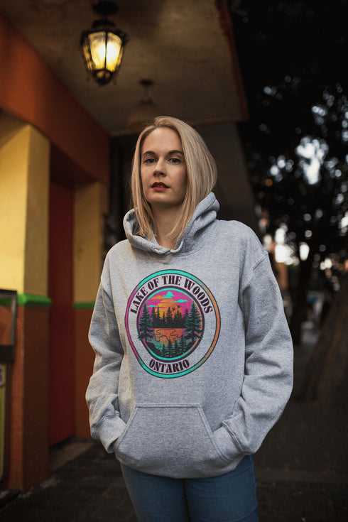 Featuring a stunning lake scene with a vibrant sunset, this hoodie captures the beauty of Lake of the Woods in Ontario, where tranquil waters meet the warm glow of a setting sun.